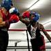 A-Square fighter Ryan Burns swings at Jonathon Conlev during the A-Square Fight Club Boxing Showcase on Friday, July 19. Daniel Brenner I AnnArbor.com
